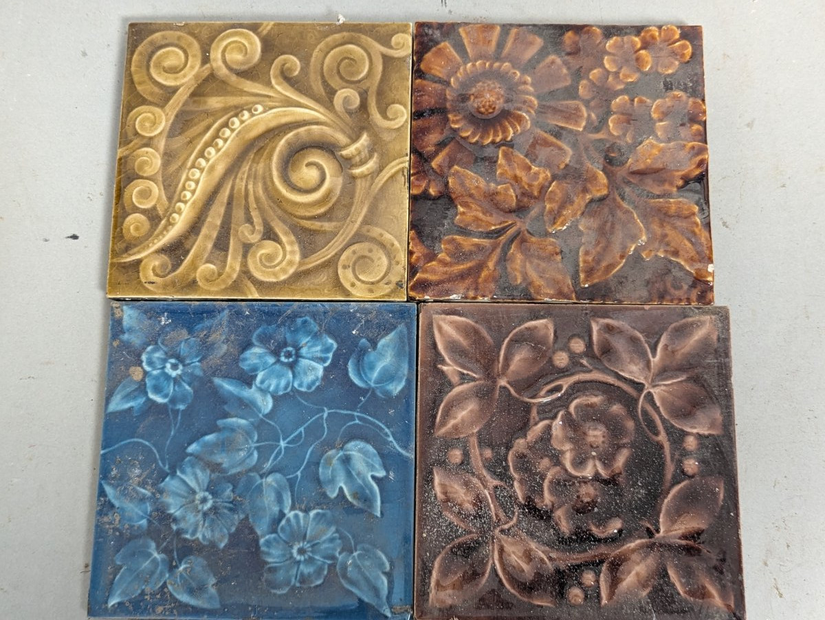 Collection of 4 Antique Ceramic Tiles Art Nouveau Floral Blue Ochre Majolica Glazed