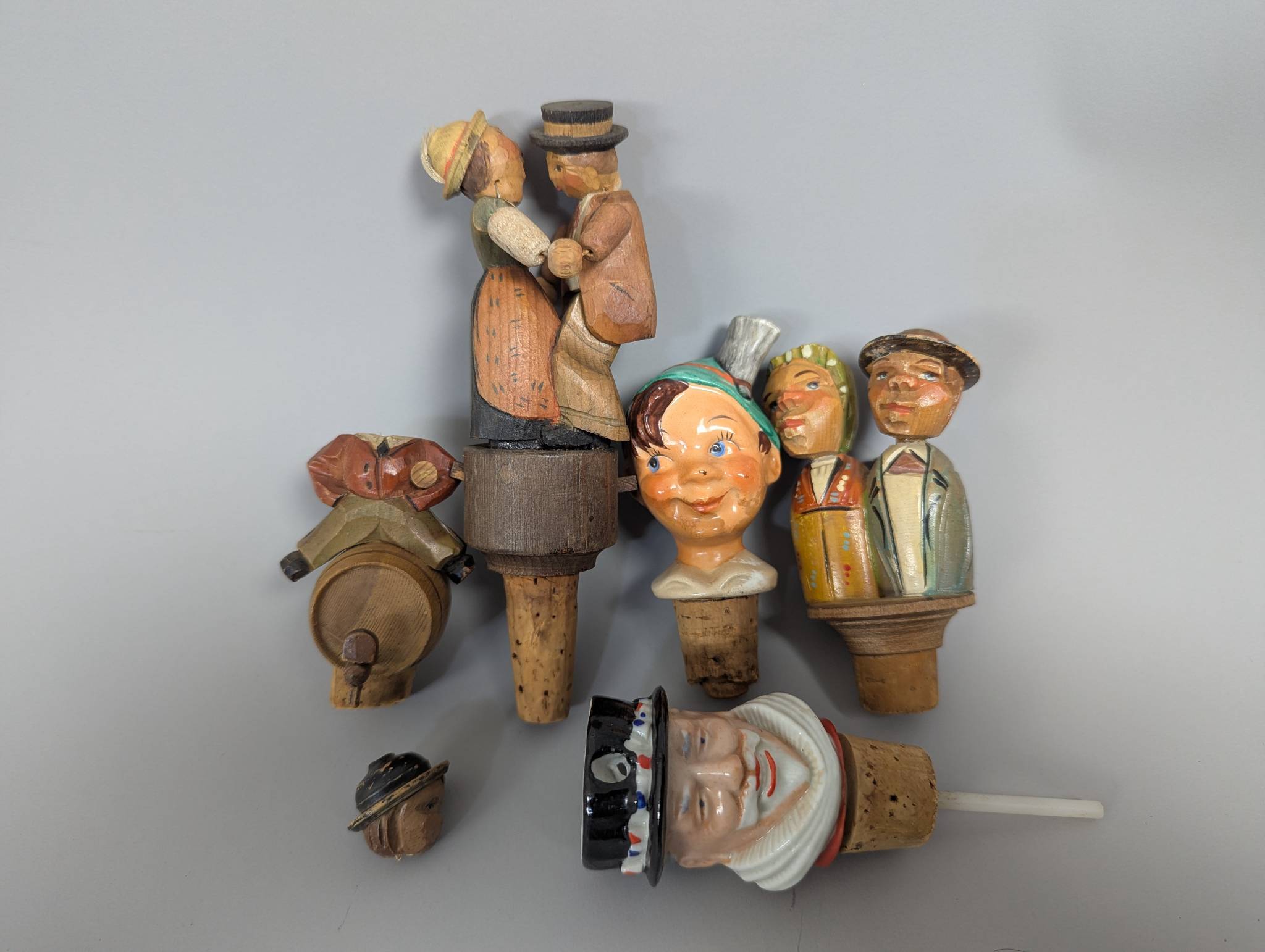 5 Antique German Carved Wood and Ceramic Bottle Stoppers