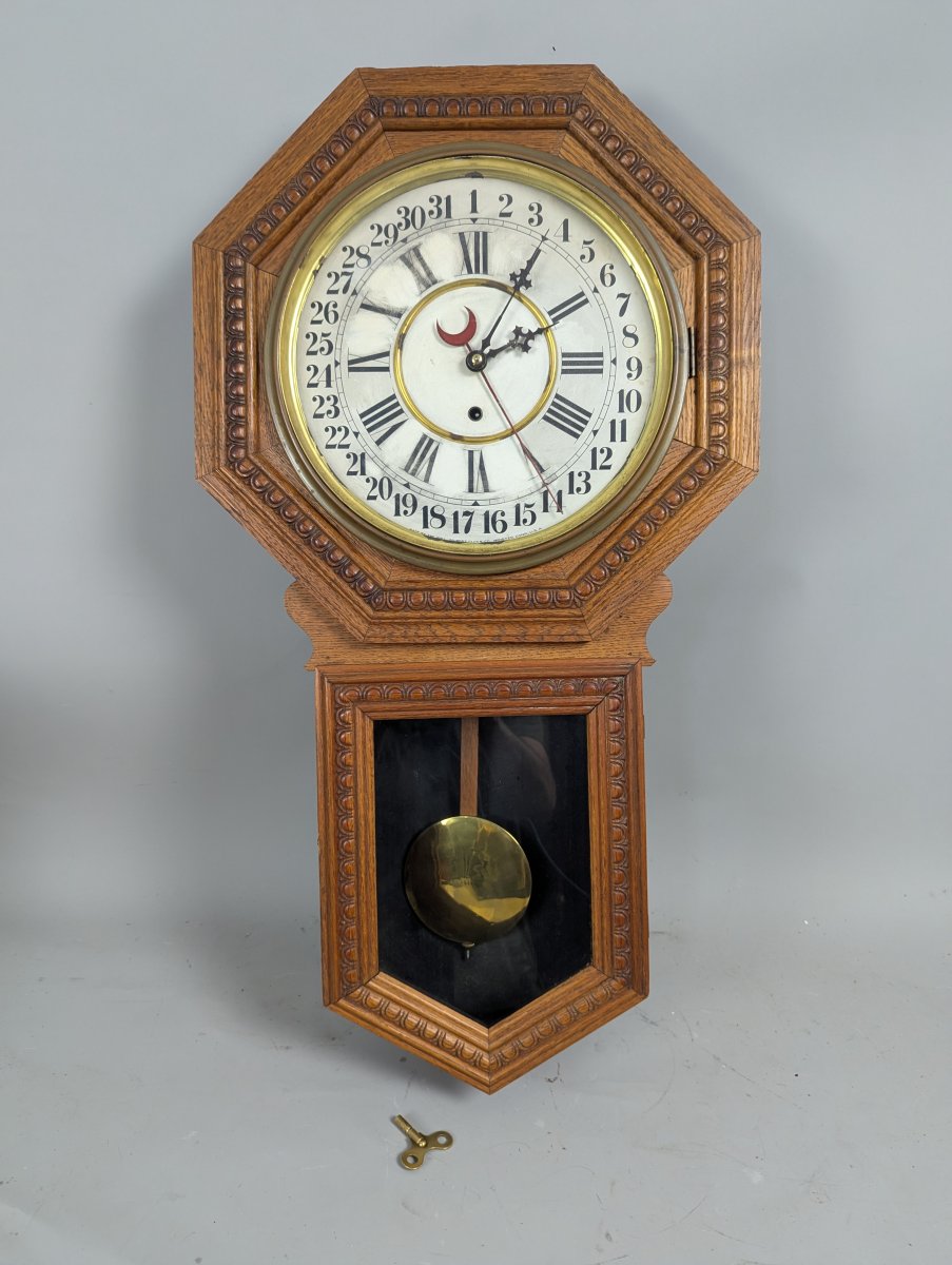 Wm. L. Gilbert Consort Model Oak Calendar Wall Clock with Pendulum and Key