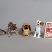 Four Royal Doulton Dog Figures Including HN 1012 and HN 1044